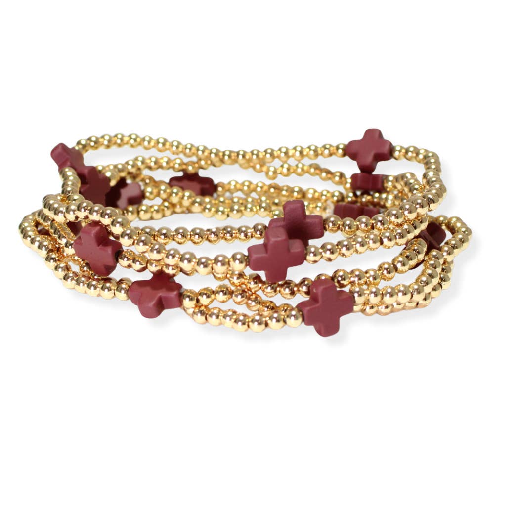 Multi layered gold bead stretch bracelet with cross accent n