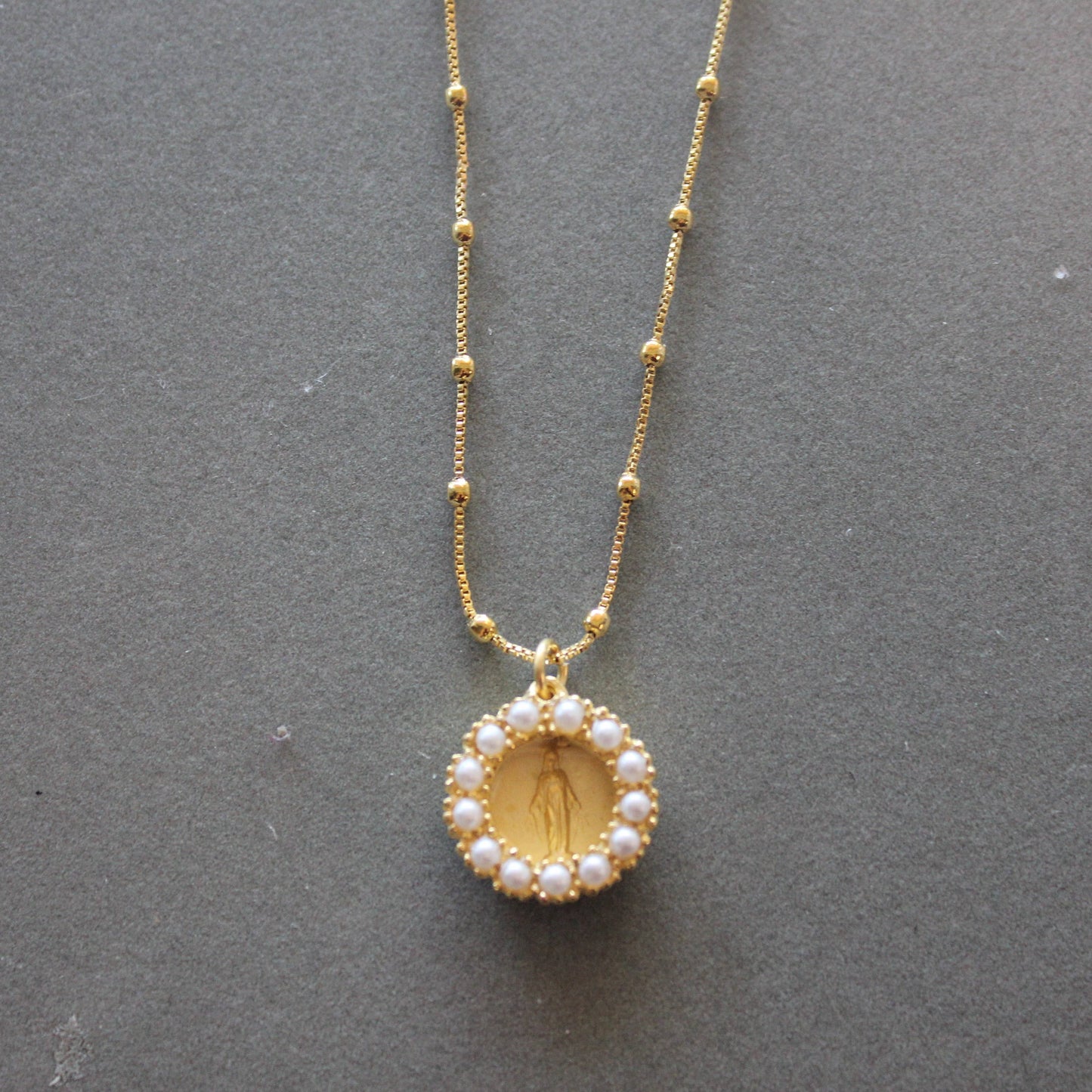 Mary medal with pearl accent on 18" gold chain