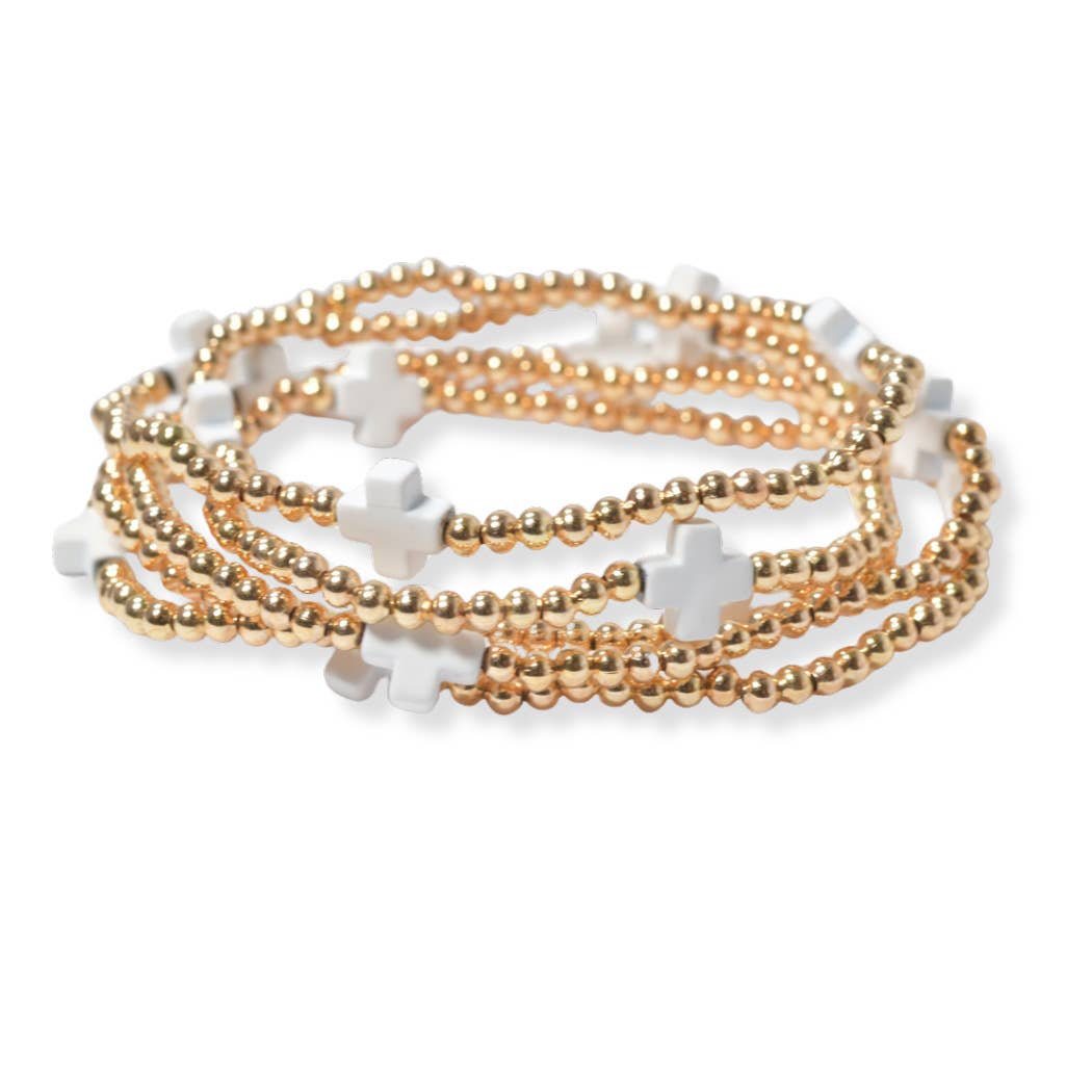 Multi layered gold bead stretch bracelet with cross accent n