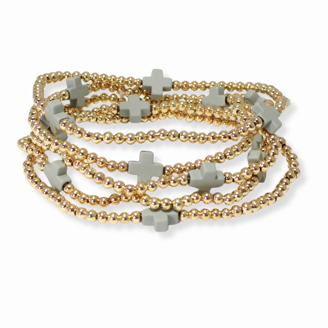 Multi layered gold bead stretch bracelet with cross accent n
